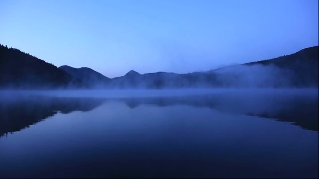 Lake Shikaribetsu and fog at sunrise, Shikaoi, Hokkaido, Japan