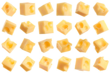 Set of delicious cheese cubes on white background