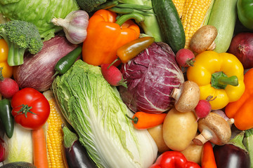 Many different ripe vegetables as background, top view