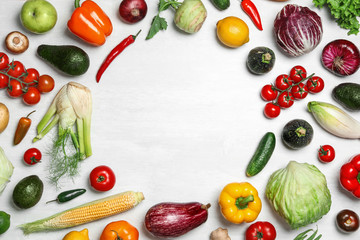 Frame made of fresh vegetables on light table, flat lay. Space for text