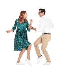 Beautiful young couple dancing on white background