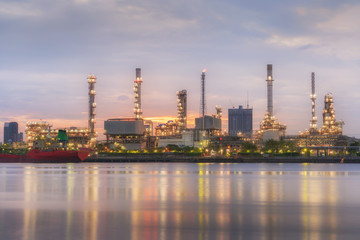 Obraz na płótnie Canvas Sunrise of Oil refinery with reflection, petrochemical plant