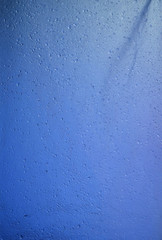 water drop on blue plastic texture