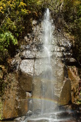 Fototapeta na wymiar Waterfall where rainbow appears