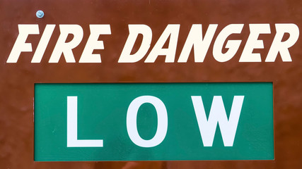 Panorama frame Close up view of a sign that reads Fire Danger Low Today
