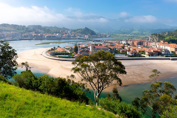 Fototapeta na wymiar Panorama of Ribadesella village and Santa Marina beach from Corberu mountain, Asturias, Spain