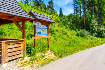 TATRA MOUNTAINS, POLAND - JUN 29, 2019: Rest stop for tourists and map with cycling ways near Dunajec river in Tatra Mountains, Poland.