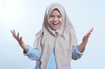 Image of excited asian young woman standing isolated over grey background