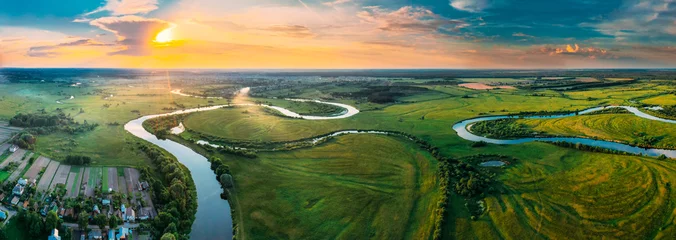 Foto op Plexiglas Aerial View Green Forest Woods Meadow And River Landscape In Sunny Spring Evening. Top View Of Beautiful European Nature From High Attitude In Summer Sunset Sunrise. Panorama, Bird's Eye View. Belarus © Grigory Bruev