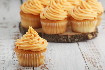 Cupcakes with orange icing on top