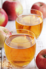 Two glasses with apple juice