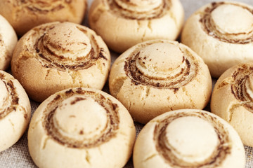 Shortbread cookies in form of champignons. Baked sweet biscuits. Tasty dessert. Selective focus.