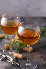 Two glasses with white wine on a textural background. Copy space. Place for your text.