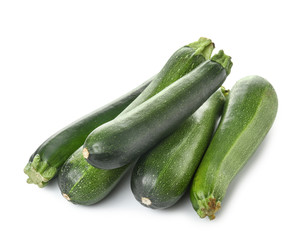 Fresh zucchini squashes on white background