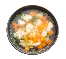 Bowl of tasty soup on white background