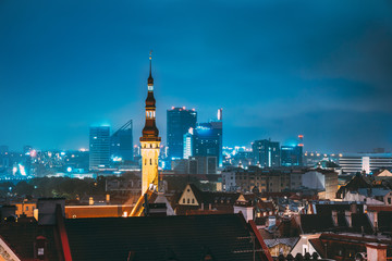 Tallinn, Estonia. Tower Of Town Hall On Background With Modern Urban Skyscrapers. City Centre Architecture
