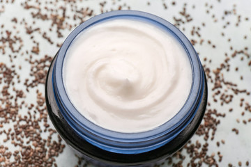 Jar of natural cream on table, closeup