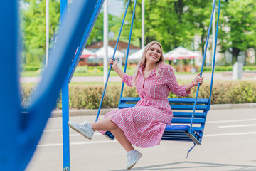 Nice american girl from next door in cotton dress walk in central park. Smiling and laughing have fun time 