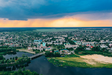 Fototapeta na wymiar Dobrush, Gomel Region, Belarus. Aerial View Of Dobrush Cityscape Skyline In Spring Sunset Sunrise Time. Residential District And River In Bird's-eye View