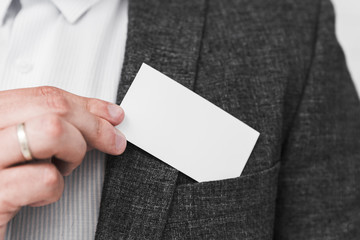 Business people showing blank business card