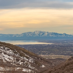 Square Lake and vast valley viewed from a mountain with trees and snow