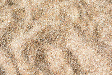 Sand texture on the beach closeup. Natural abstract background
