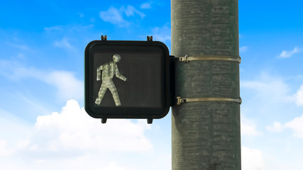 Panorama Close up of pedestrian traffic light signal against blue sky and bright clouds