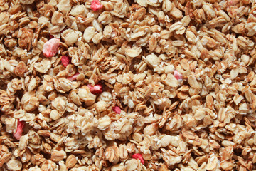 Granola background. Healthy organic breakfast and snack concept. Cereal granola  with nuts and dried fruits.