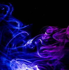 Colored smoke on black background