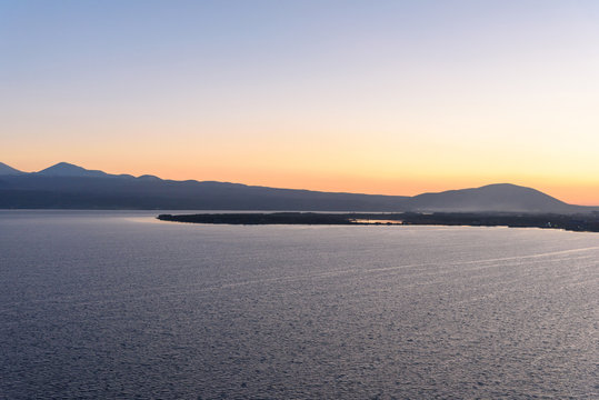 the endless expanses of Lake Sevan in the golden season, in the light of the setting sun, in the autumn yellow-golden brown color.