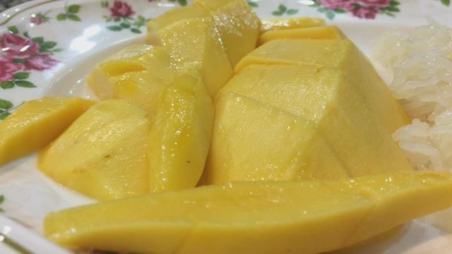 Fresh thai yellow mango background, rotates, close up