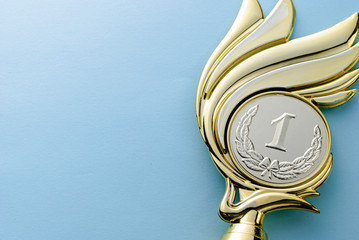 Gold medallion winners trophy with laurel wreath