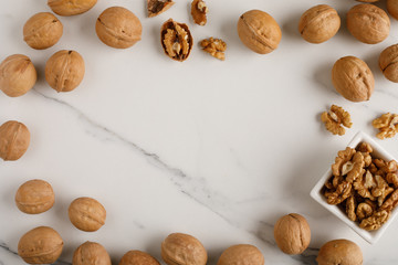 frame made of walnut on white marble background