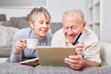 Two seniors shopping online
