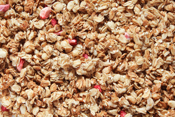 Granola background. Healthy organic breakfast and snack concept. Cereal granola  with nuts and dried fruits.