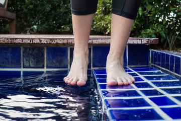 Dipping toe in swimming pool
