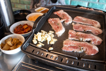 Korean style barbeque Samgyeopsal with garlic