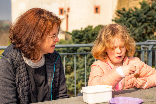 Woman with child picnic on castle Scharfenstein