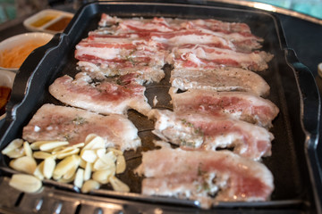 Korean style barbeque Samgyeopsal with garlic