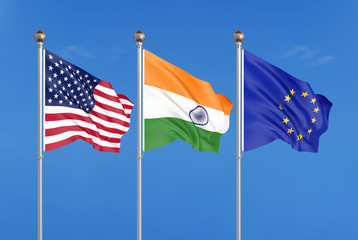 Three colored silky flags in the wind: USA (United States of America), EU (European Union) and India. 3D illustration.