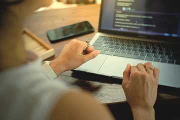 hands typing on laptop