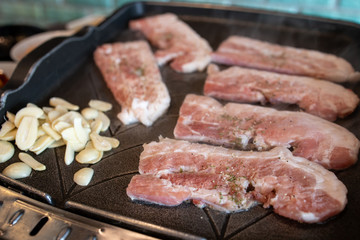 Korean style barbeque Samgyeopsal with garlic