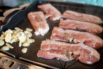 Korean style barbeque Samgyeopsal with garlic
