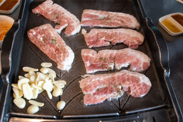 Korean style barbeque Samgyeopsal with garlic