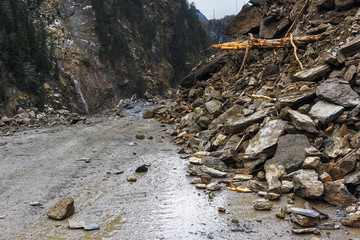 The road was blocked by a rockfall.