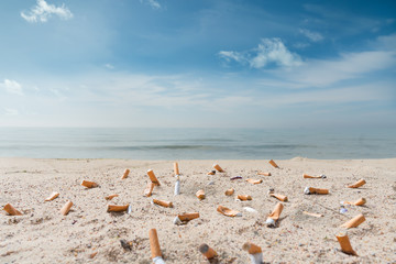Fototapeta na wymiar pollution on the beach due to cigarettes