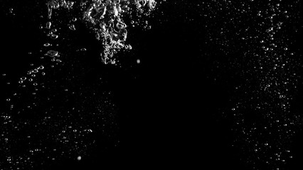 Water bubbles floating after splash underwater and black background which represent freshness of...