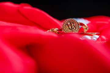 Raksha bandhan rakhi on red background