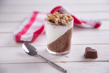 Delicious breakfast, cocoa chia pudding with yogurt and cereals