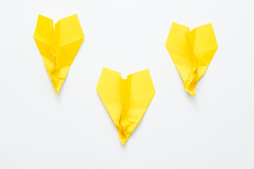 Business failure. Three yellow crumpled paper airplanes isolated on white background. Copy space.
